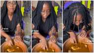 Ghanaian lady causes stir in public as she sips soup with straw, video evokes laughter