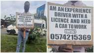 Ghanaian man begs to be employed as driver by holding placard in the street