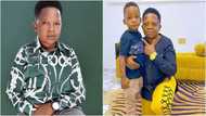 This is suspicious, why isn't he standing? Hilarious reactions as actor Pawpaw kneels beside son for a photo