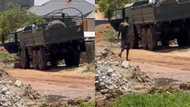 Video of military vehicle being used to offload blocks at residential area drops