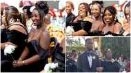 Plus-size Ghanaian bridesmaid turns heads with her elegant black gown at a lavish wedding