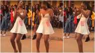 Pretty lady in heels shows off dance moves and fine legs during competition, her audience shout in video