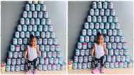 Mum posts photo of her baby and cans of milk she consumed, image goes viral; "87 tins of milk in 12 months"