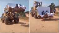 Bride and groom in gown and suit use caterpillar machine for their wedding; video stirs reactions