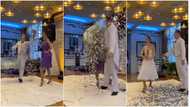 No be juju be that? Lady in purple gown transforms into white dress as silver particles rain on her in video