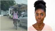 She left peeps in awe: Ghanaian woman who hawks groundnut on bicycle impresses folks as video of her goes viral