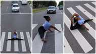 Lady sits in middle of the highway, opens her legs wide in yoga posture as cars wait for her; "I got scared"