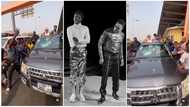 Kuami Eugene and Rotimi spray cash on fans on the streets of Accra, video causes stir