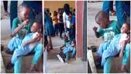 Boy licks spoon like a mother in video & feeds his crying little sister in school while mum took quiz