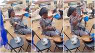 Ghanaian woman seen enjoying funeral food while crying for the dead
