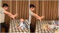 He understood the assignment: Baby falls on bed dramatically as he & dad 'fight' in funny video
