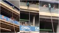 Video shows moment brave man risked his life to hang rope & rescue trapped victims in Kejetia fire