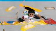 Iranian greeted as hero after competing without hijab