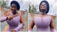 Video of curvy Ghanaian wedding guest with small waist wows peeps with dance moves: "Thank you for covering up"