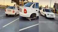 Opel driver uses trolley to replace missing wheel; gets people worried