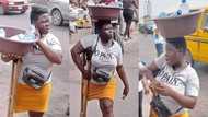 Daring hustler: Physically impaired girl in crutches sells pure water on street