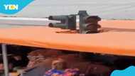 Public outrage as trader erects shade directly under traffic light in Kasoa