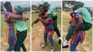 "Mother's love is powerful": Lady visits her son in secondary school, carries him like a baby on her back