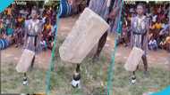 Ghanaian student in Volta Region suspended building block on top of a bottle during school cultural day