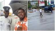 Junior police officer praised for standing in heavy rain all day to save lives & prevent accidents