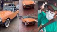 Man shows of his 1977 MG midget car that is still in good condition after 44 years, drives it in clip