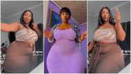 Pretty lady with huge curves whines waist gently, her video trends on social media