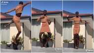 Pretty dark-skinned lady 'taller than house' dances in video, her height shakes many online