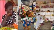 GH mum seen carrying twins and selling water gets provision shop, 2 years' rent, other goodies; photos pop up