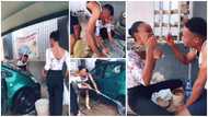 Video shows lady paying surprise visit to lover who works at car wash, joins him in working