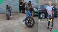 Man living abroad finds old car tyre, plays with it like a child, obroni wife watches with amazement