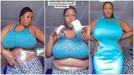 Plus-size lady with belly fat uses cellotape to make her tummy flat, teaches women