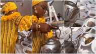 Video captures lady serving ewedu and gbegiri with kettles, netizens share mixed reactions