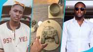 Despite's son Saahene Osei shows off his dirty hands after using clay to mould a PS 4 controller