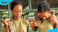 Lady at Shai Hills Resource Reserve plays with python in video, asks viewers to come and try it