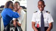 Mummy's boy: Cute photo of handsome young pilot with mum in an aircraft causes stir online