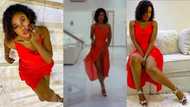 Lady in red: Becca flexes her beauty as she shows off her plush living room in video and photos