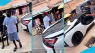 Swedru businessman Abu Trica parks GH¢2million BMW i8 by roadside, wears simple outfit