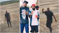 "My oga get money" - Video of Davido's boy running around airport with bell in his hand stirs reactions