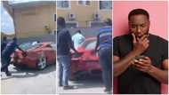 Man expresses his surprise as he sees 2 men pushing faulty Ferrari in public
