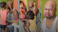 "Somebody save him": Dad almost in tears as daughters design his face with make-up in video