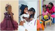 Medikal & Island: Ghanaian rapper plays piano and football with daughter on her 1st day at school, many gush over cute photos