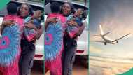 8 years after, lady who moved abroad when she was single returns with 3 kids, her family celebrates