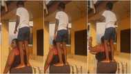 Ghanaian mother displays amazing strength as son stands on her huge backside in video: “Try this when he is 25”