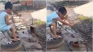 Smart boy: massive reactions as creative kid operates manual excavator, packs dirt from gutter