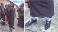 Video of GH woman shamelessly rocking a pair of male shoes & socks at a funeral causes stir