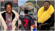 Michael Blackson carries pan on his head, holds blue bucket, takes to the streets of Accra to sell peanuts; many fans laugh at his efforts