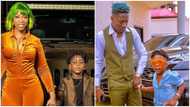 World's best dad: Michy shades Shatta Wale as their son snubs him & gives touching gift to mom on Father's Day