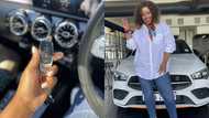 Lady blesses herself with expensive white Mercedes Benz, shares impressive photos