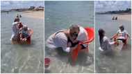 Lady spotted in video bathing her 94-year-old grandma with a chair in the ocean to make her dream come true