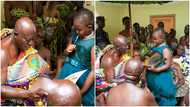 Adorable 7-year-old girl presents book she wrote to Asantehene; takes heartwarming photos with him